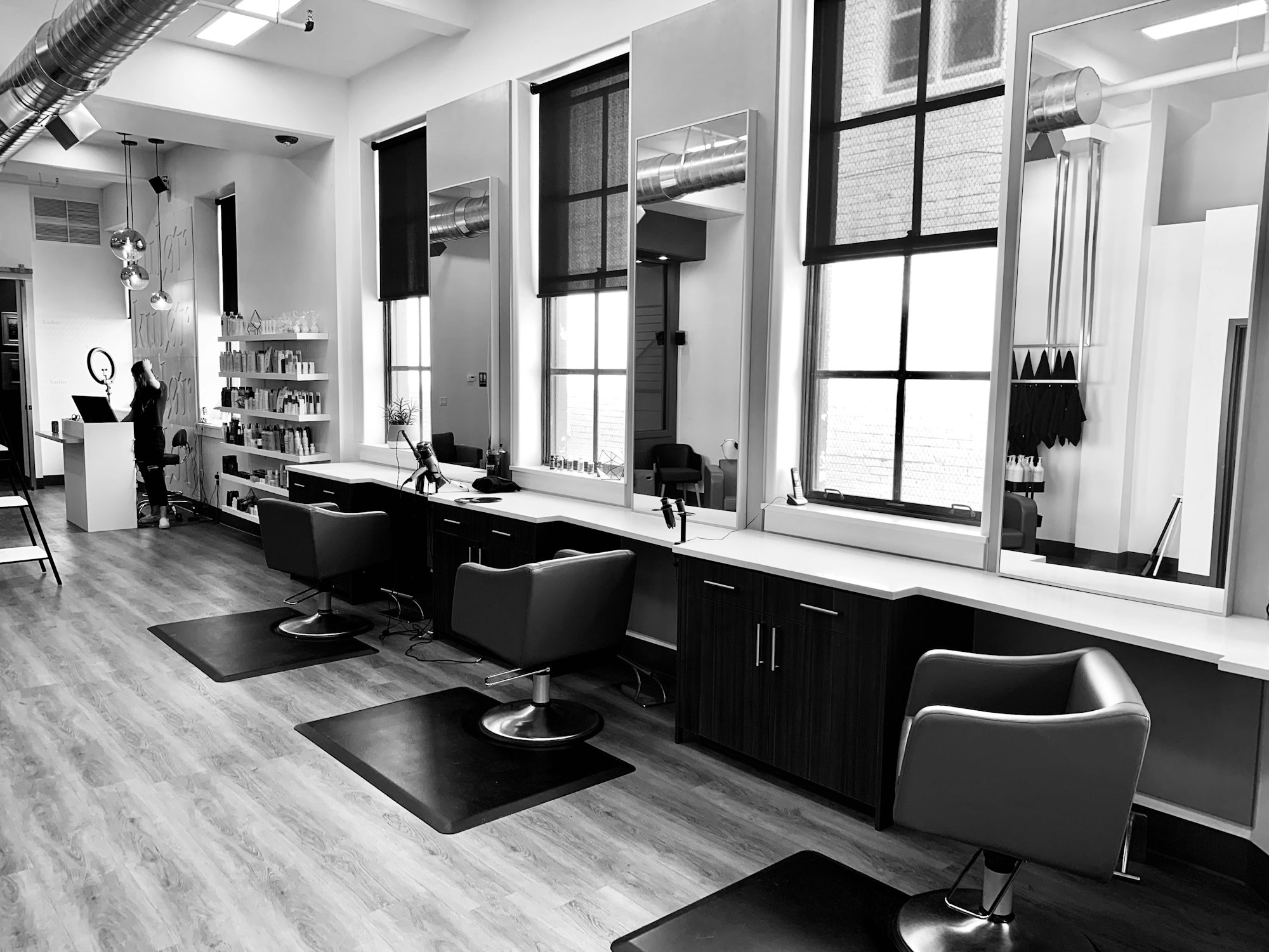 Black and white salon interior with styling chairs